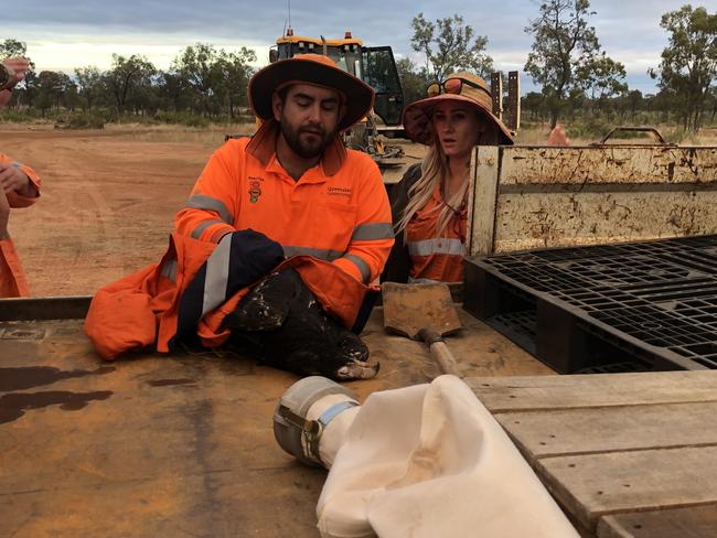 Transport and Main Roads workers Owen Foster and Martika Brandon helped free Eddie the eagle from barbed wire.