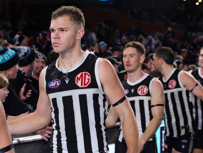 ADELAIDE, AUSTRALIA - AUG 17: Dan Houston of the Power with fans after the win during the 2024 AFL Round 23 match between the port Adelaide Power and the Adelaide Crows at Adelaide Oval on August 17, 2024 in Adelaide, Australia. (Photo by Sarah Reed/AFL Photos via Getty Images)