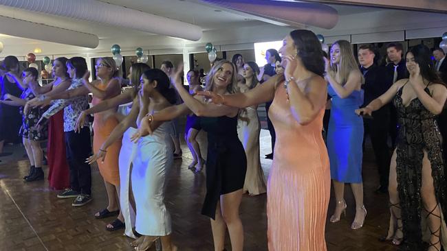 Melba College Year 12 graduates and teachers do the Nutbush at their Valedictory on December 8. Picture: Supplied.