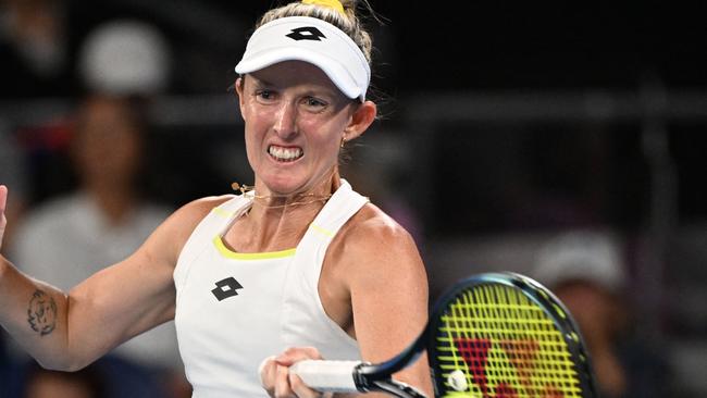 Australia's Storm Hunter hits a return against Germany's Laura Siegemund during their women's singles match on day four of the Australian Open tennis tournament in Melbourne on January 17, 2024. (Photo by WILLIAM WEST / AFP) / -- IMAGE RESTRICTED TO EDITORIAL USE - STRICTLY NO COMMERCIAL USE --