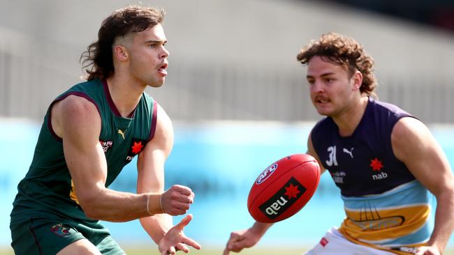 Tassie’s Lachlan Cowan gets a hand pass away. Pic: Getty.