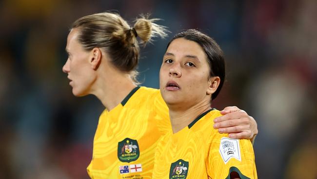 SYDNEY, AUSTRALIA - AUGUST 16: Sam Kerr of Australia is consoled by Emily Van-Egmond after the team's 1-3 defeat and elimination from the tournament following the FIFA Women's World Cup Australia & New Zealand 2023 Semi Final match between Australia and England at Stadium Australia on August 16, 2023 in Sydney / Gadigal, Australia. (Photo by Brendon Thorne/Getty Images)