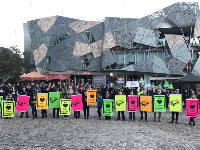 About 200 people at Federation Square to protest plans for an Apple flagship store. Picture: AAP/Andi Yu