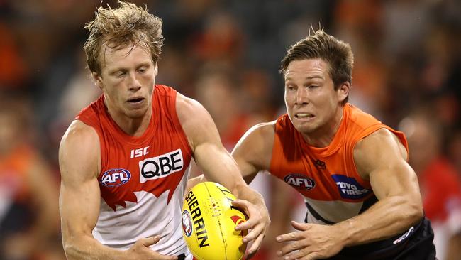 GWS’ Toby Greene attempts to tackle Sydney’s Callum Mills. (Photo by Cameron Spencer/Getty Images)