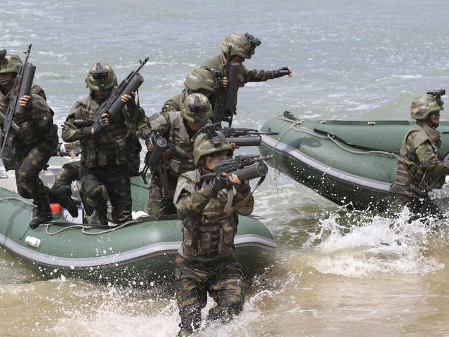 The North Korean government released this picture on Saturday showing special operation forces training as part of simulated attacks on South Korean islands. Picture: Korean Central News Agency/Korea News Service/AP