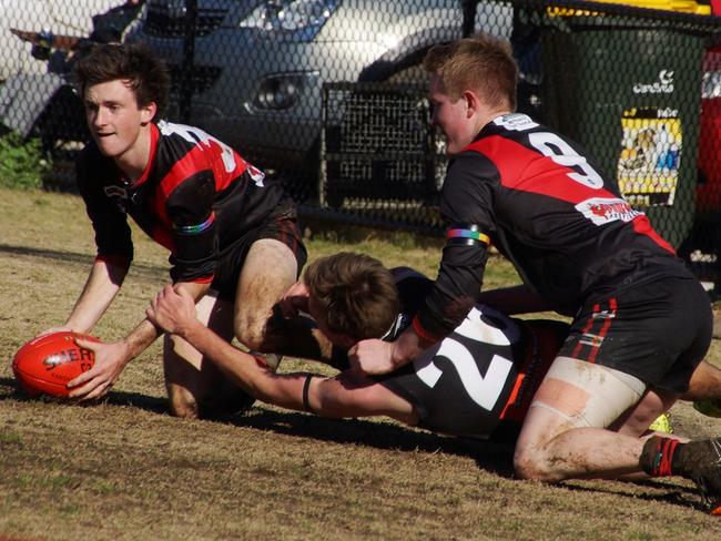 Emerald’s Josh Webb clears the ball.