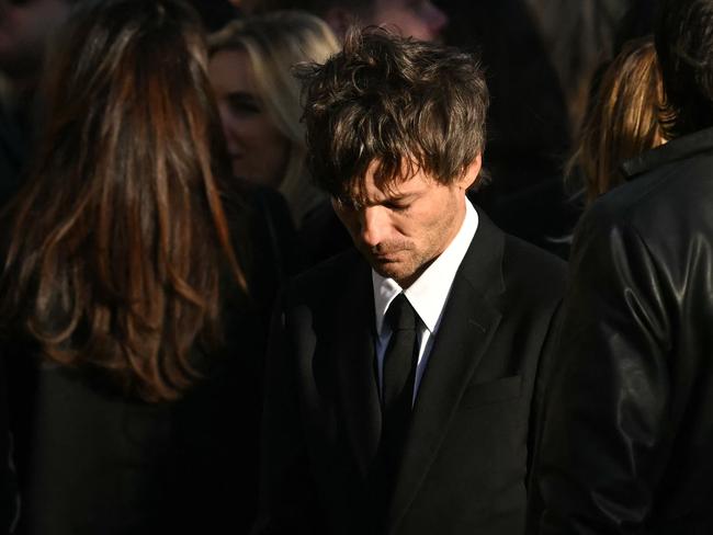 Former One Direction band member Louis Tomlinson left with his head bowed. Picture: AFP