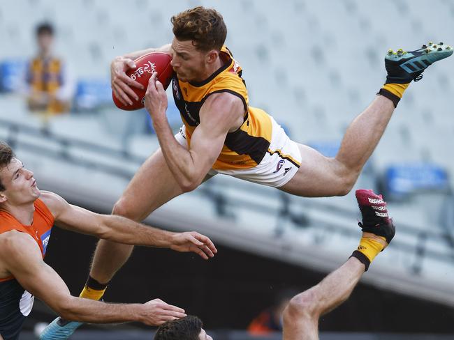 MELBOURNE, AUSTRALIA - JUNE 27: Tim O'Brien of the Hawks takes a spectacular mark during the round 15 AFL match between the Greater Western Sydney Giants and the Hawthorn Hawks at Melbourne Cricket Ground on June 27, 2021 in Melbourne, Australia. (Photo by Daniel Pockett/Getty Images)