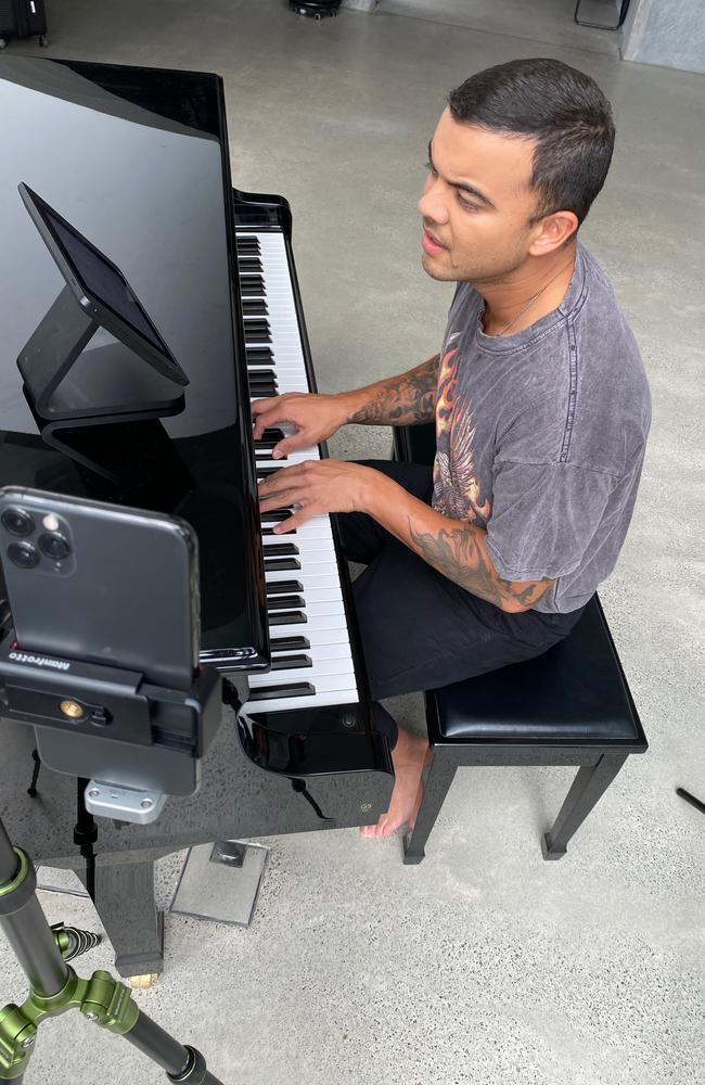 A barefoot Guy Sebastian gives fans a musical treat from his house. Picture: Jules Sebastian