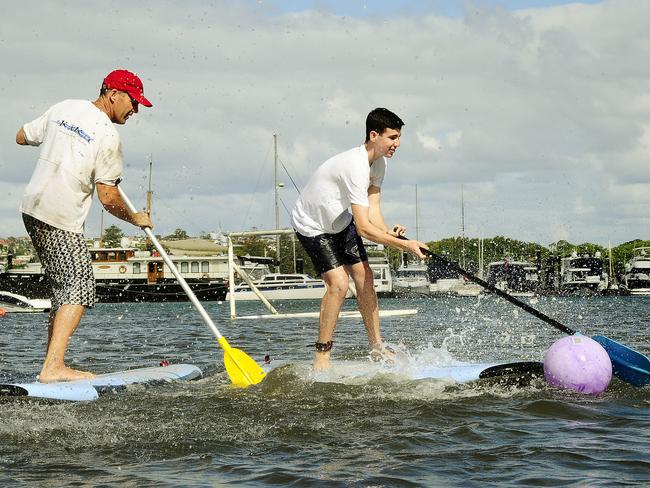 Lance O'Connor and Paul Strasser -17 playing Stand Up paddle Board Soccer in Rose Bay. Picture: John Appleyard.