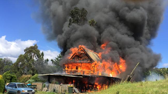 House fire at Huon Highway Geeveston. Tasmania Fire Service attended and occupants were believed to be not home at the time of the fire. Picture: STEWART WARDLAW