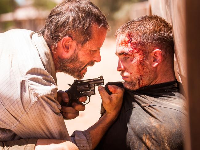 Guy Pearce and Robert Pattinson in a scene from Australian film <i>The Rover</i>.