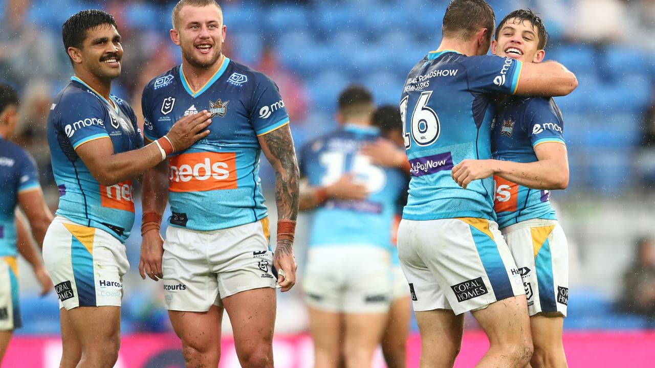 Titans players celebrate after clinching a spot in the NRL finals. Picture: Chris Hyde/Getty Images