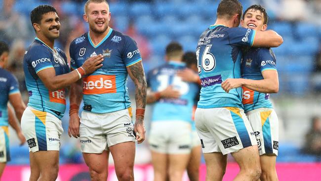 Titans players celebrate after clinching a spot in the NRL finals. Picture: Chris Hyde/Getty Images