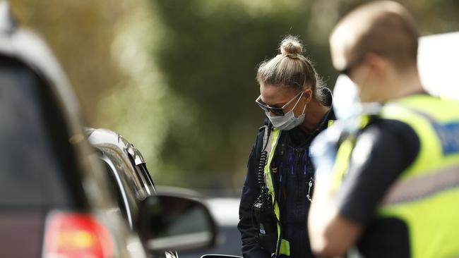 Police speak with drivers in Melbourne on Tuesday. Picture: Getty Images