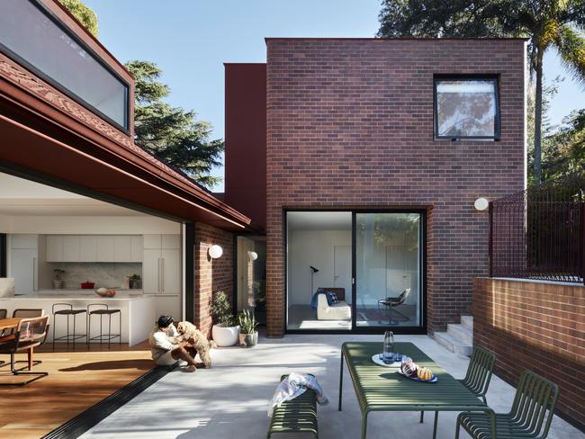 A separate two-storey brick ‘tower’ now accomodates the couple’s daughters.