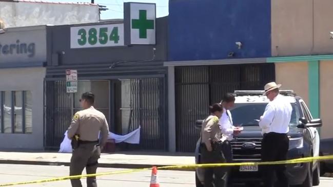 A crime scene set up outside a marijuana dispensary in West Slauson Ave, Los Angeles, after Mr Bennett was gunned down about 9.45am local time last Friday. Picture: 9 News