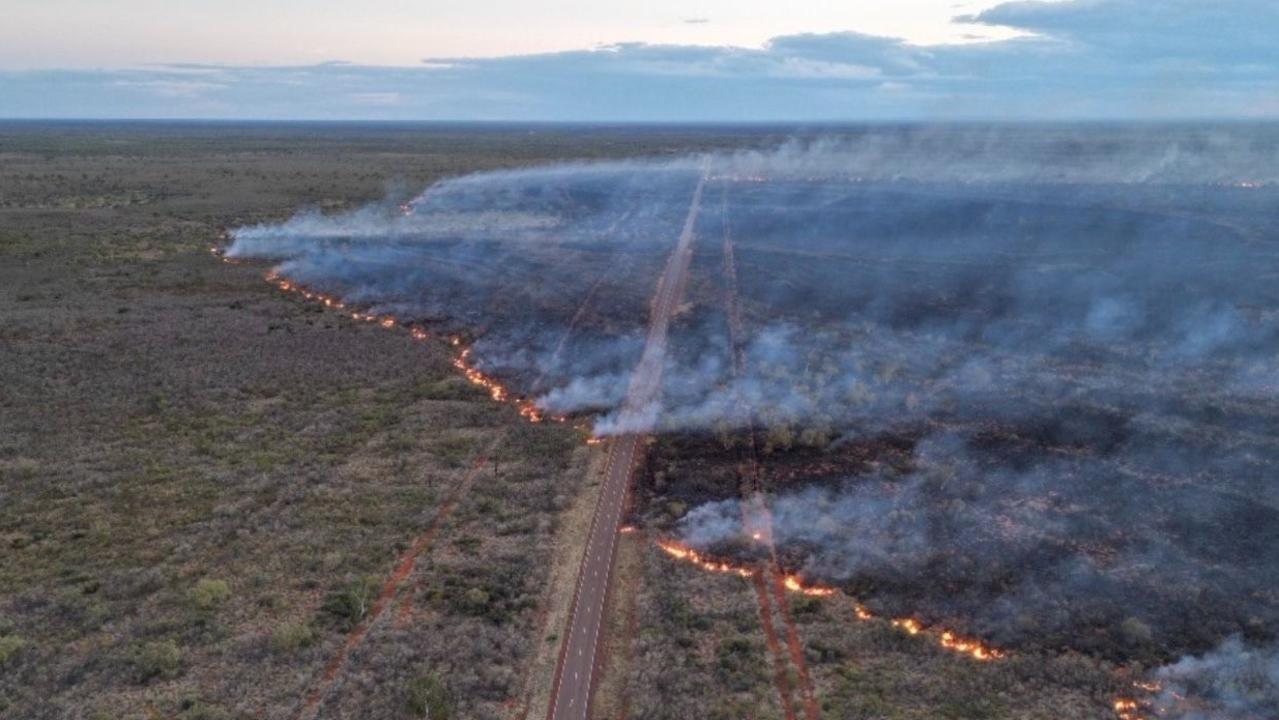 Smoke impacted the Stuart Hwy on Sunday from a fire north of Wycliffe Well. Picture: BushfiresNT.