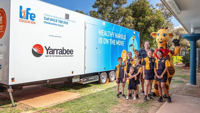 Blackwater North State School students meeting Healthy Harold after a session about positive health, wellness and how their bodies work.