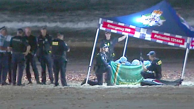 Police at the scene where a baby girl died on the beach at Surfers Paradise. Picture: Channel 7