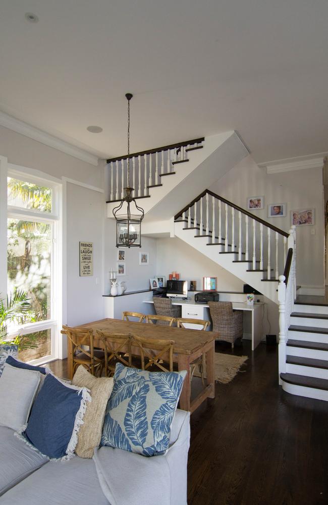 Built-in shelving services this under stair study nook designed by Sophie Solomon.