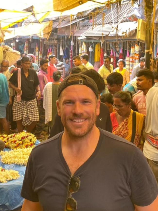 Aaron Finch poses in India