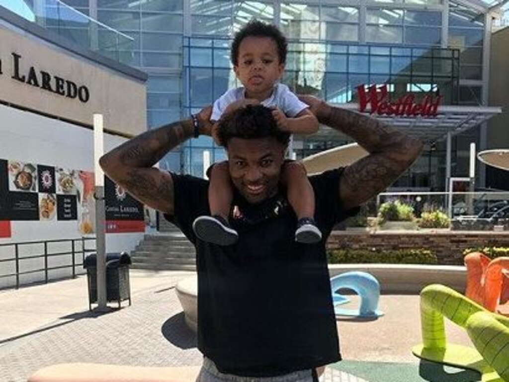 Jordan Caroline with his son JC in 2019.