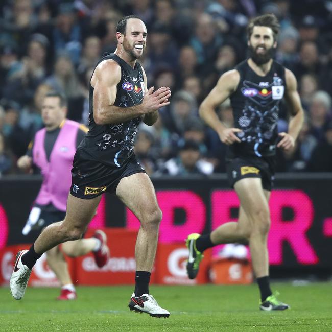 Matthew Broadbent, who spoke out about his mental health struggles, celebrates his goal with Justin Westhoff in the background while playing for the Power. Picture: Sarah Reed.