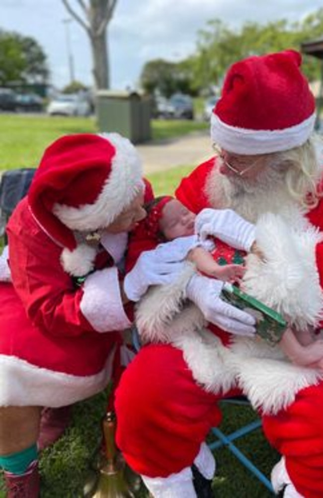 Destiny is pictured with Santa &amp; Mrs Clause, who were absolutely enamoured by her cuteness.