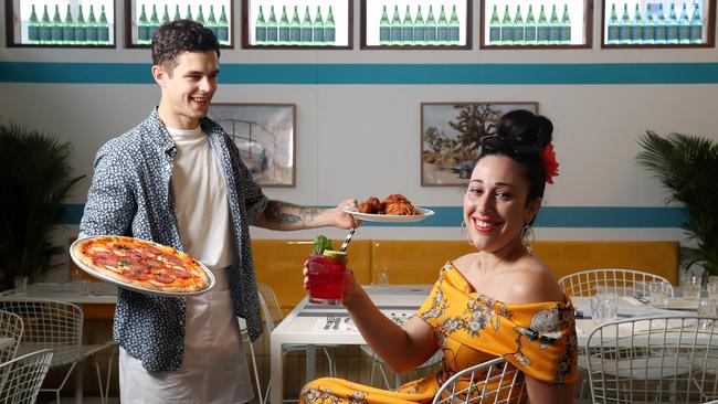 Darren Hearne serves fashion designer Cristina Tridente food and a rose shaker cocktail at Chicco Palms. Picture: CALUM ROBERTSON