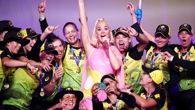 Players celebrate victory alongside international pop superstar Katy Perry, who performed at the record-breaking event. Picture: Cameron Spencer/Getty Images