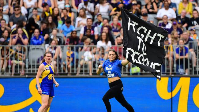 PERTH, AUSTRALIA - FEBRUARY 15: A streaker invades the field during the 2020 AFLW Round 02 match between the West Coast Eagles and the Fremantle Dockers at Optus Stadium on February 15, 2020 in Perth, Australia. (Photo by Daniel Carson/AFL Photos via Getty Images)