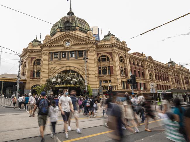 MELBOURNE, AUSTRALIA - NCA NewsWire Photos November 21, 2020:  People are seen at a busy Flinders Street Station in Melbourne, Victoria. Picture: NCA NewsWire / Daniel Pockett