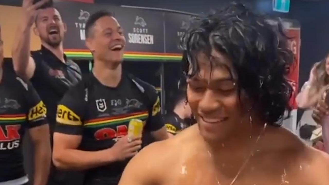 Brian To'o gives his fiancee a lap dance in the sheds at Suncorp Stadium after the Panthers' Grand Final win.