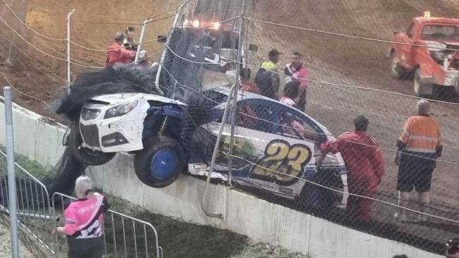 Speedway driver Brendan Cowley had a spectacular crash during the running of the Queensland modified sedans state title in Rockhampton. Photo: Kent Murray