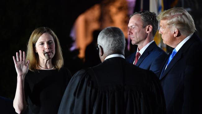 US President Donald Trump and Jesse M. Barrett watch as Supreme Court Associate Justice Clarence Thomas swears in Amy Coney Barrett. Picture: AFP