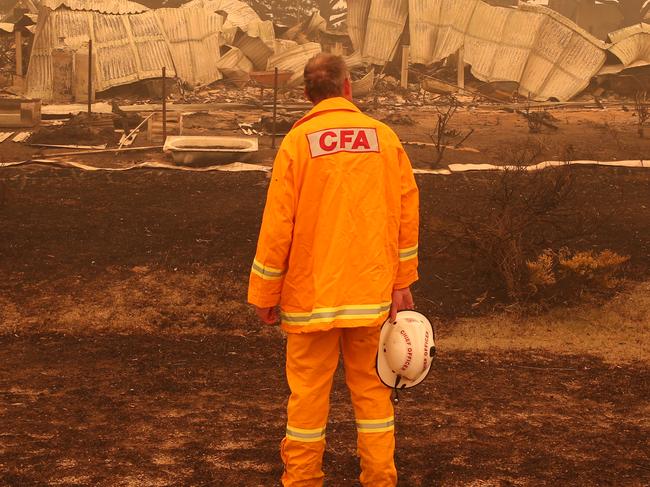 BEST PICTURES 2020. Gippsland Fires. CFA Chief officer Steve Warrington inspects the damage in Buchan after a bushfire struck the town. Friday, January 3, 2019. Picture: David Crosling/Herald Sun