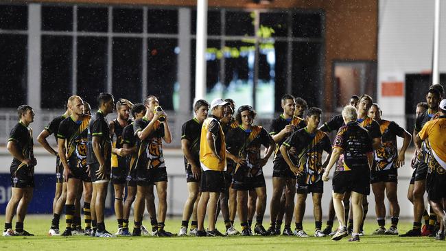 Nightcliff player's wait for a final decision to be made about whether their game will go ahead. Picture: KERI MEGELUS