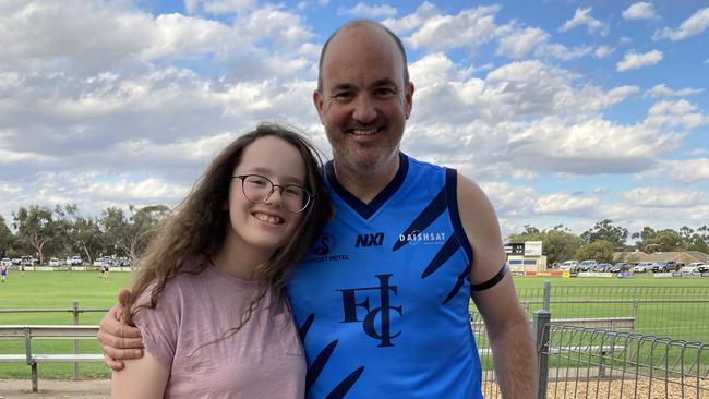 46-year-old Brad Shiell with his daughter in his 2022 playing days. Picture: Supplied