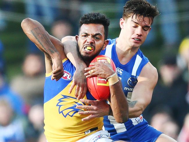 HOBART, AUSTRALIA - JULY 29:  William Rioli of the Eagles is tackled high by Jy Simkin of the Kangaroos but received no free kick during the round 19 AFL match between the North Melbourne Kangaroos and the West Coast Eagles at Blundstone Arena on July 29, 2018 in Hobart, Australia.  (Photo by Michael Dodge/Getty Images)