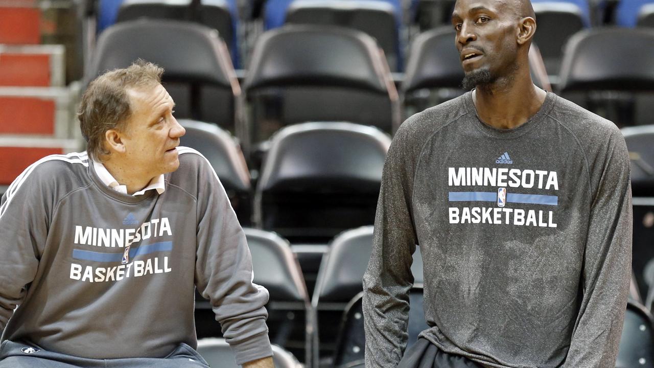 Minnesota Timberwolves' Kevin Garnett, right, talks with head coach Flip Saunders after his first practice on his return to his former team that originally drafted him out of high school, Tuesday, Feb. 24, 2015, in Minneapolis. Garnett waived his no-trade clause with the Brooklyn Nets to return to Minnesota. (AP Photo/Jim Mone)