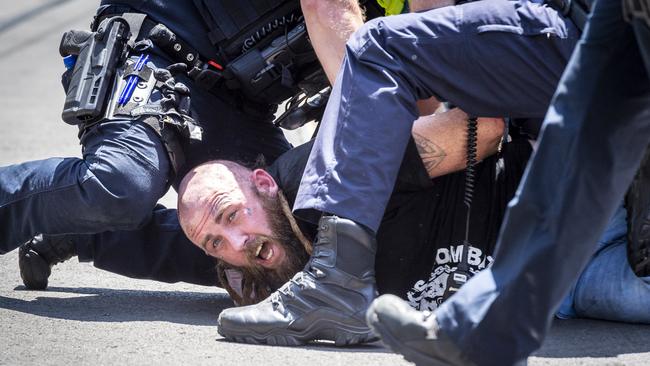 A man is arrested on Tuesday in Melbourne's CBD. Picture: Jake Nowakowski