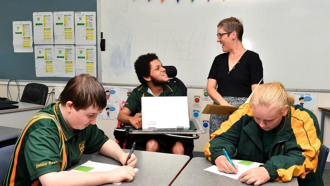 Pioneer High School students Brandon Cash, Chris Malone and Nikkita Weston with Head of Special Education Laura Theodore. Picture: Tony Martin