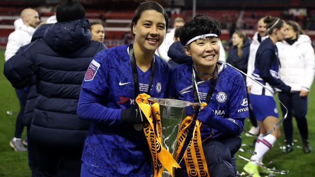 Chelsea’s Sam Kerr, left, and Ji So-yun celebrate with the trophy following the FA Women's Continental League Cup final against Arsenal. Picture: Getty Images