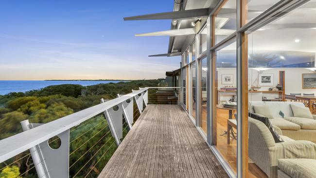 The cedar deck at the front overlooks the vegetation along the dunes behind Santa Casa Beach.