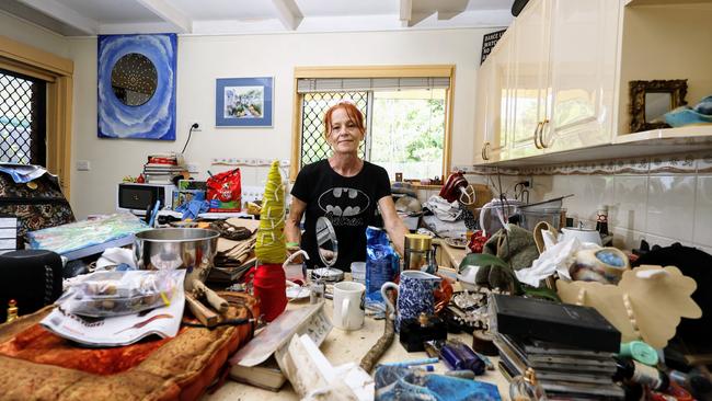 Melissa Trommestad stands in her flooded home at Holloways Beach, north of Cairns. Picture: Brendan Radke