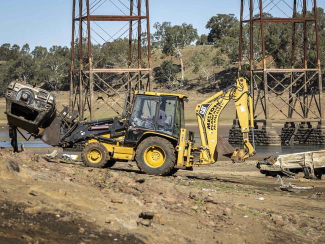 Three cars were removed from the site on Friday. Picture: Jake Nowakowski