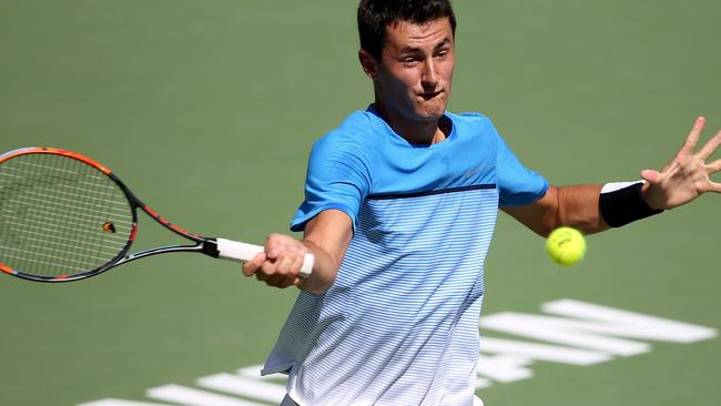 INDIAN WELLS, CA - MARCH 14: Bernard Tomic of Austrailia returns a shot against Milos Raonic of Canada during the BNP Paribas Open at the Indian Wells Tennis Garden on March 11 at Indian Wells Tennis Garden on March 12, 2016 in Indian Wells, California Sean M. Haffey/Getty Images/AFP == FOR NEWSPAPERS, INTERNET, TELCOS & TELEVISION USE ONLY ==