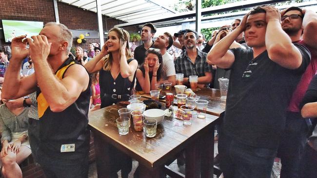 The streets of Richmond ablaze with the colours of yellow and black in 2017. Richmond supporters watch the game in the London Tavern. Picture: Tony Gough