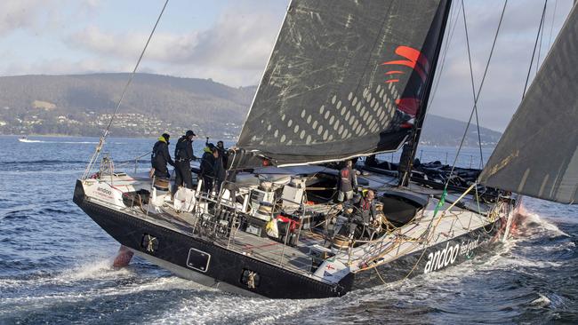 Andoo Comanche leads over eventual race winner LawConnect in the Derwent River during the 2023 Rolex Sydney Hobart yacht race. Picture: Chris Kidd